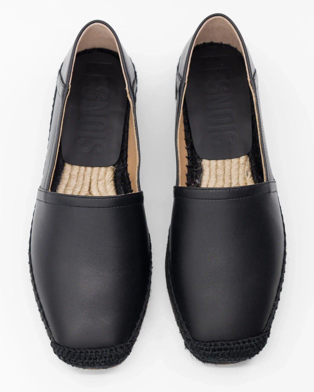 Scarpe nere in pelle con suola intrecciata, stile espadrille comode e casual